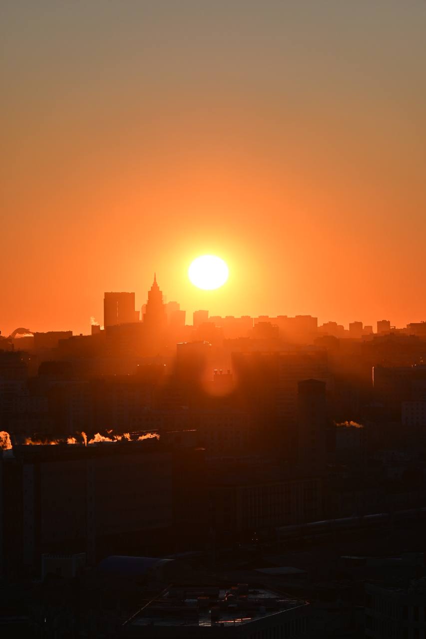 a sunset over a city